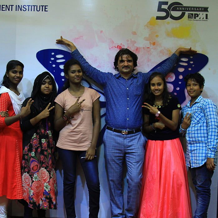 Santosh Talaghatti with youth participants at the Project Management Institute 50th Anniversary celebration